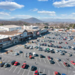 Drone view of Lake Drive Plaza Kroger storefront and parking.