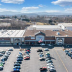 Drone view of Lake Drive Plaza Kroger entrance, Starbucks, and Pharmacy.