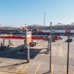 Wide view of Rushville plaza Kroger gas station with plaza in the background.