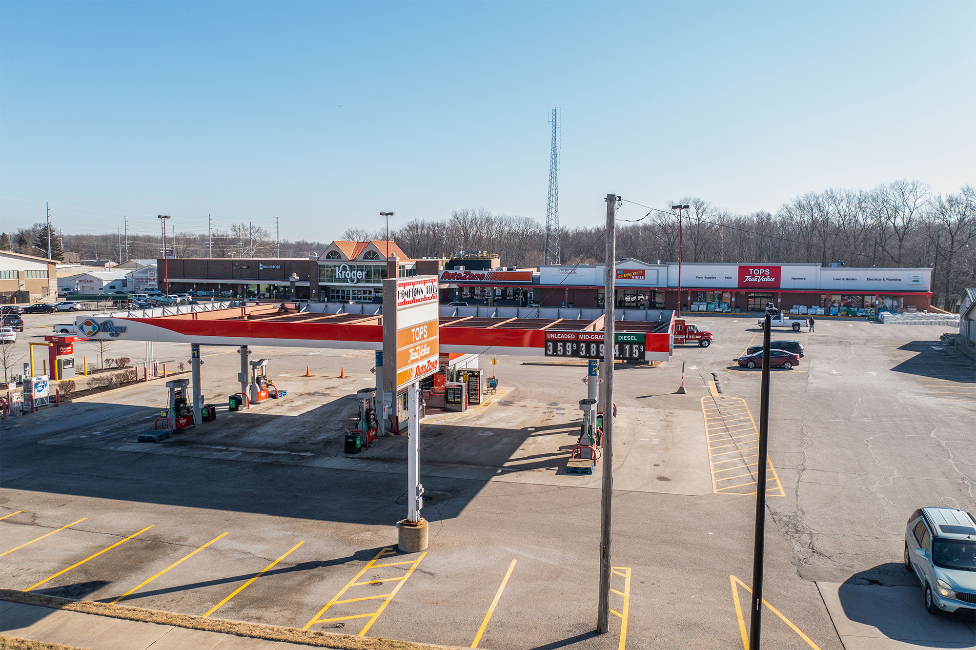 Wide view of Rushville plaza Kroger gas station with plaza in the background.