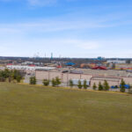 Drone view of Shoppes of Mason with Kings Island theme park in the distance.