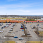 Drone view of Shoppes of Mason storefronts and parking.