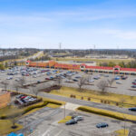 Drone view of Shoppes of Mason storefronts and parking.