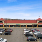 Shoppes of Mason Mercy Health storefront and The Old Bag of Nails Pub.