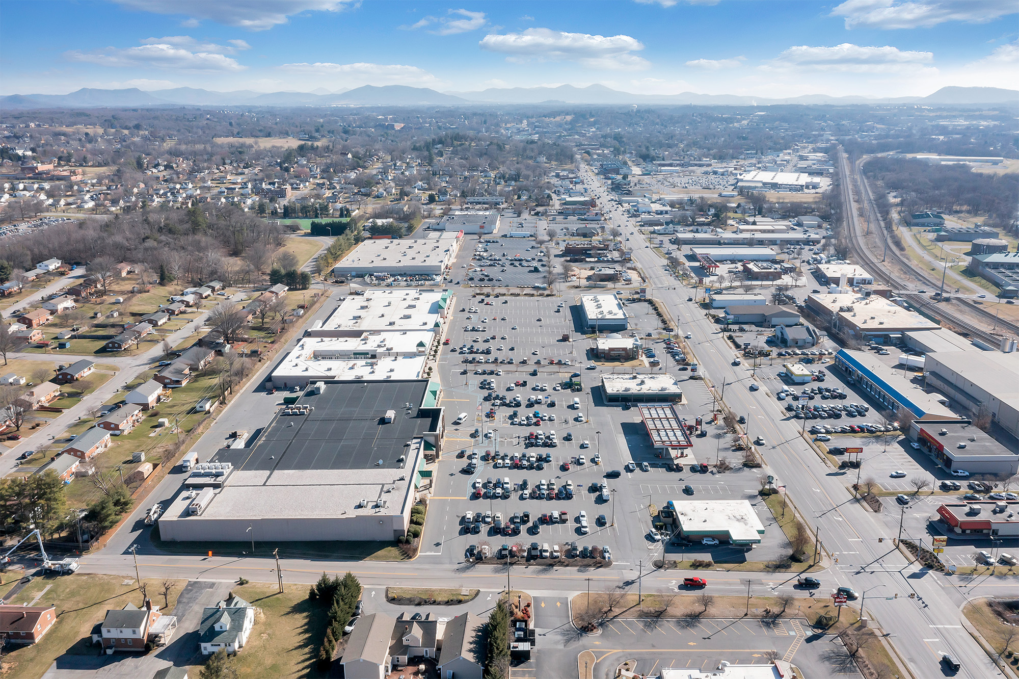 Drone view of Spartan Square with mountains in the distance.