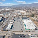 Drone view of Spartan Square and Main St with mountains in the distance.