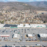 Drone view of Spartan Square shopping and Main St.