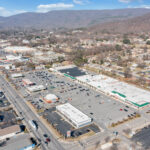 Drone view of Spartan Square shopping center and parking.