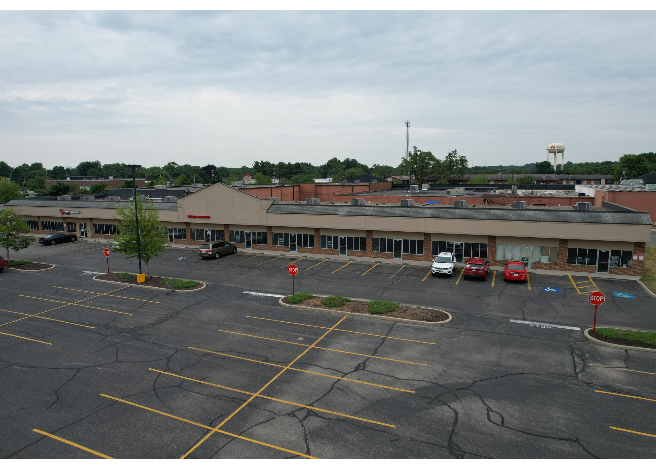 Woodland Crossing Heart City Health and Elkhart Nutrition parking lot aerial view.