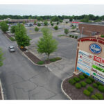 Woodland Crossing, tenant sign aerial view, W Hively Ave entrance.