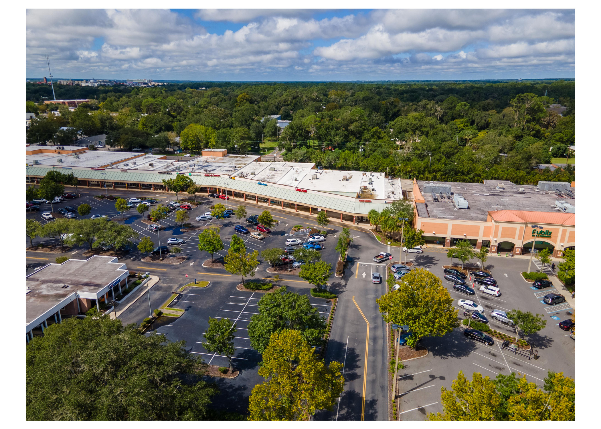 Gainesville Shopping Center, Publix, PNC Bank, Liquor and parking lot aerial view.