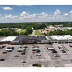 Plymouth Plaza Kroger and Planet Fitness front entrances, and parking lot aerial view.