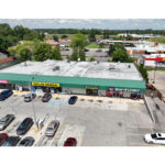 Plymouth Plaza, T-Mobile, Dollar General, Advance America Cash Advance and Rent A Center parking lot, aerial view.