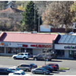 Linwood Square, Boost Mobile, Game Stop, Coin Laundry, Cricket, and parking lot, aerial view