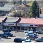 Linwood Square, ibrows, Happy Garden, Boost Mobile, Game Stop, CoinLaundry, and parking lot, aerial view