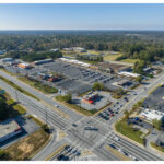 Merchants Square, Kroger, Panda Express, and parking lot. Route 85 and Bethsaida Rd intersection, aerial view.